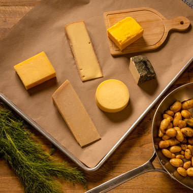 Culinary collection cheese gift set Parmigiano Reggiano, Aged Cheddar, Reading Raclette, High Lawn Farm Butter